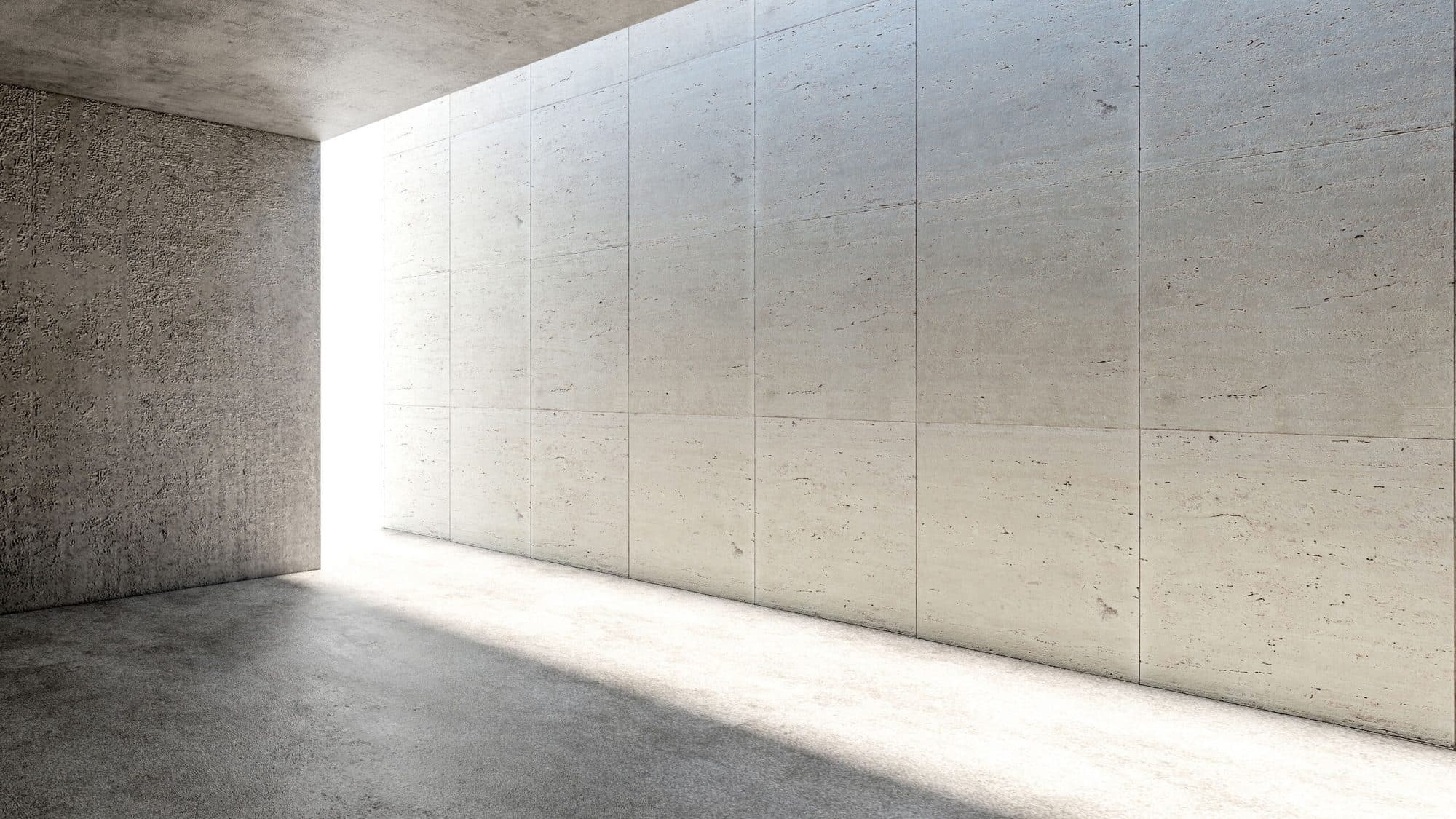 Warm-lit corridor with seamless micro cement walls